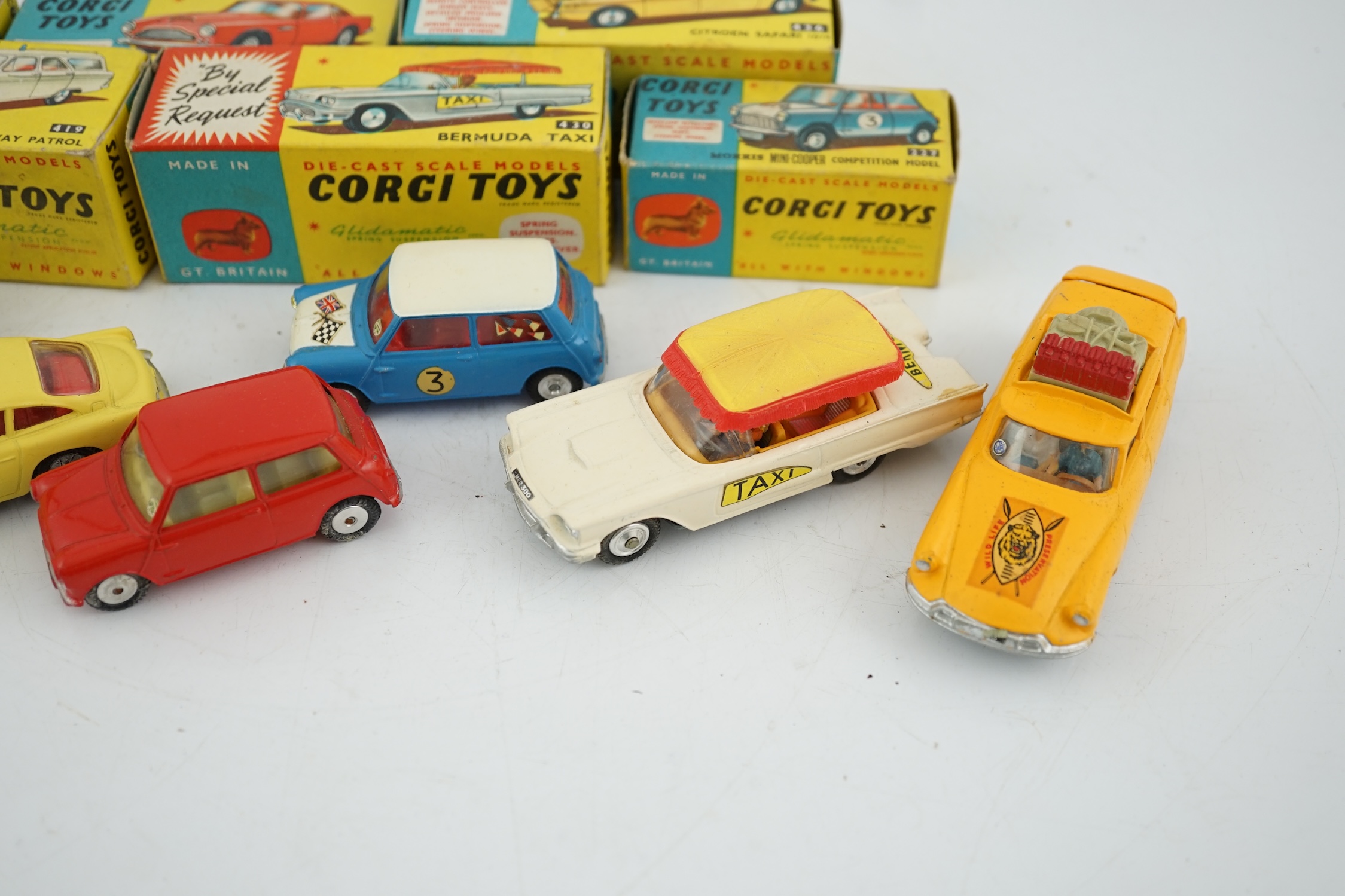 Six boxed Corgi Toys cars; Aston Martin DB4 in yellow (218), Austin seven in red (225), Morris Mini Cooper competition model (227), Ford Zephyr motorway patrol (419), Ford Thunderbird Bermuda Taxi (430), Citroen Safari (